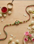 Elegant Meenakari Lotus Kundan Rakhi with Beaded Accents