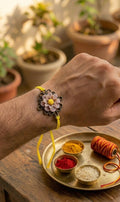 Vintage-Style Floral Metal Rakhi with Mauve Petals